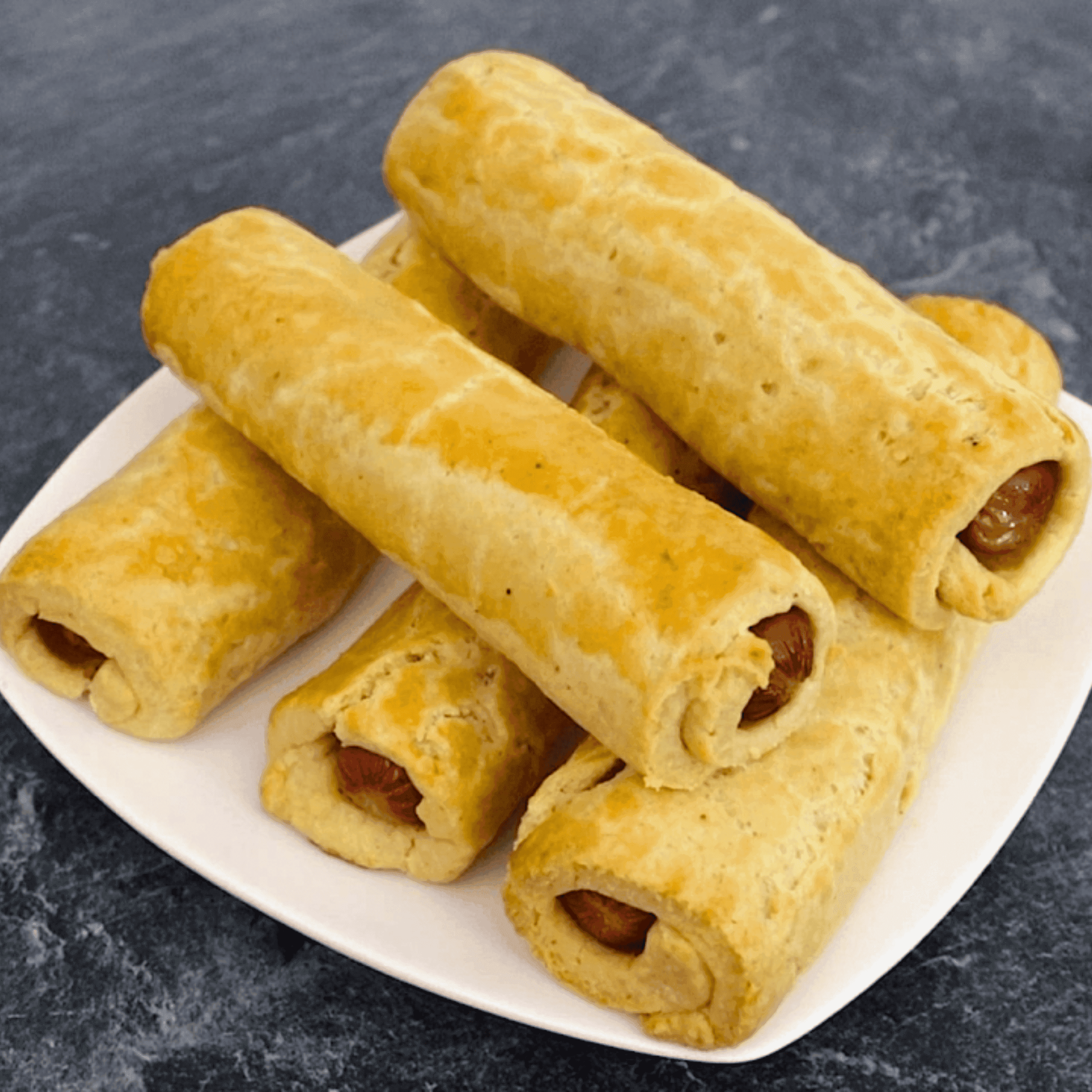 Freshly baked Nigerian sausage roll with flaky puff pastry and premium sausage filling